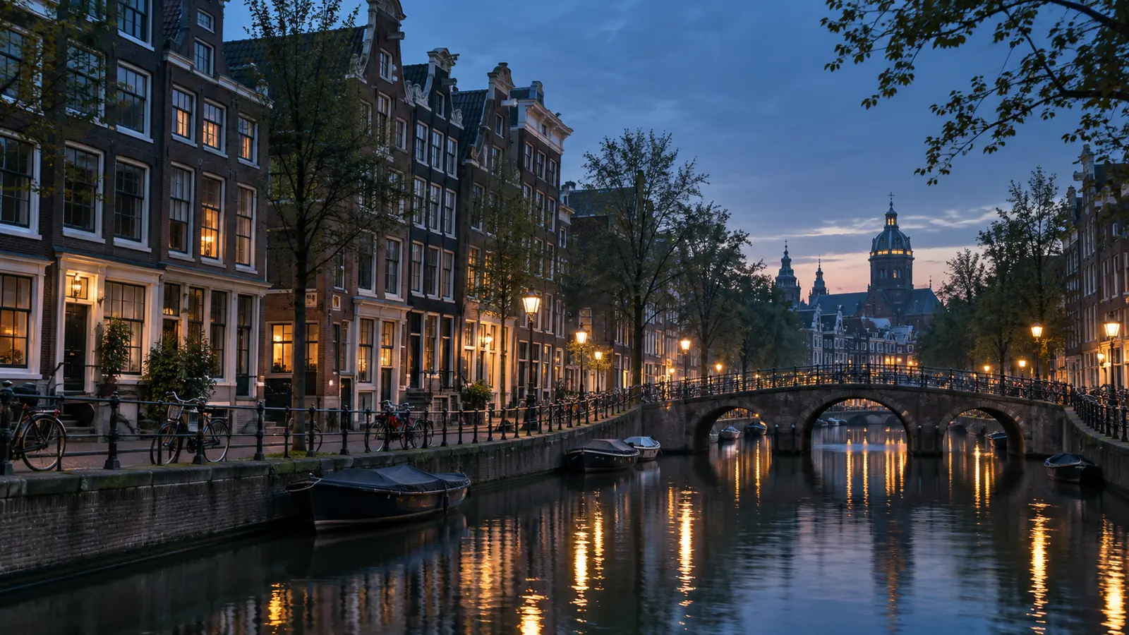 Amsterdam canal houses, bicycles and bridges in the early morning